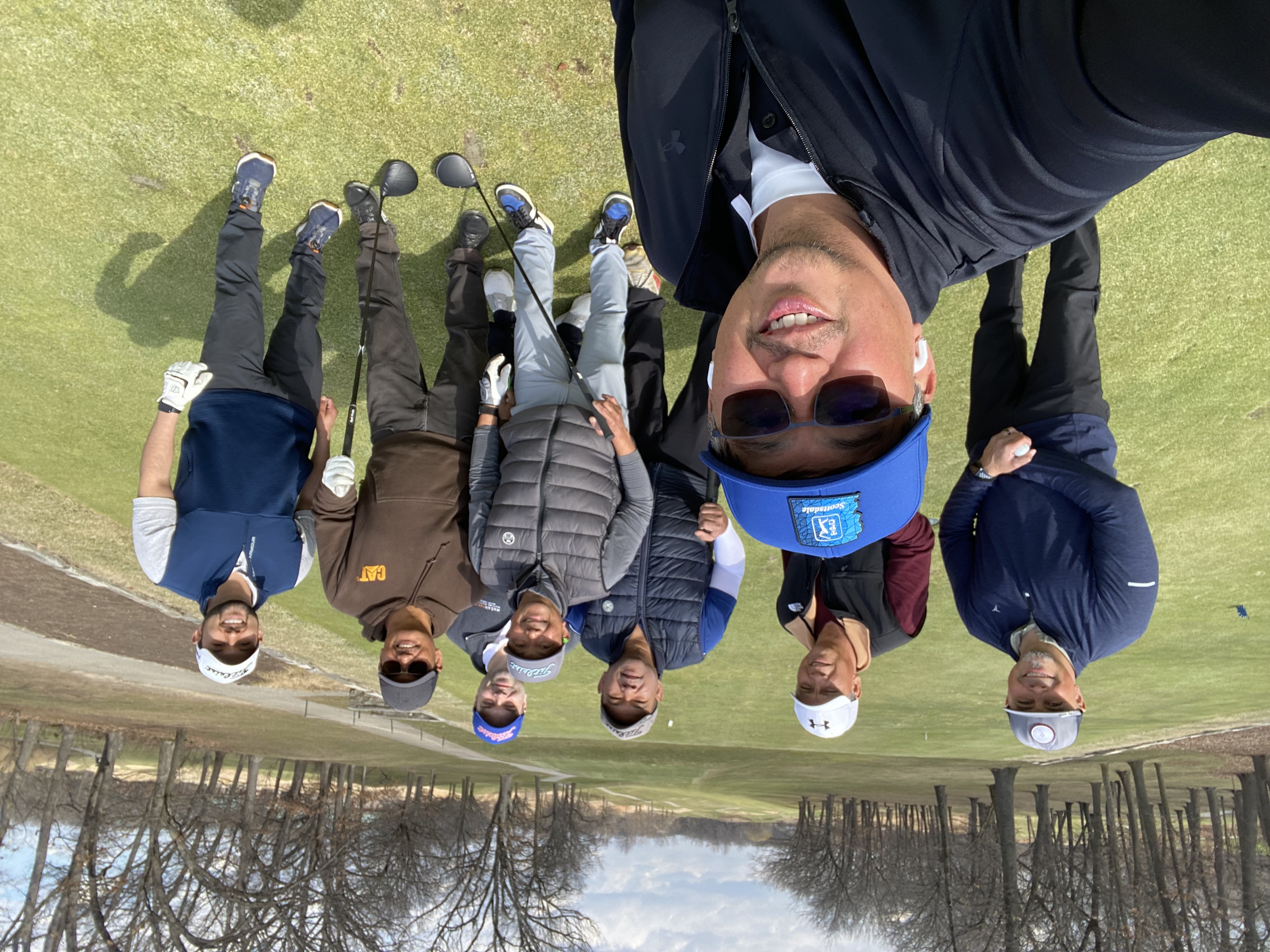 FAGA Chicago group selfie on the course — eight members posing together