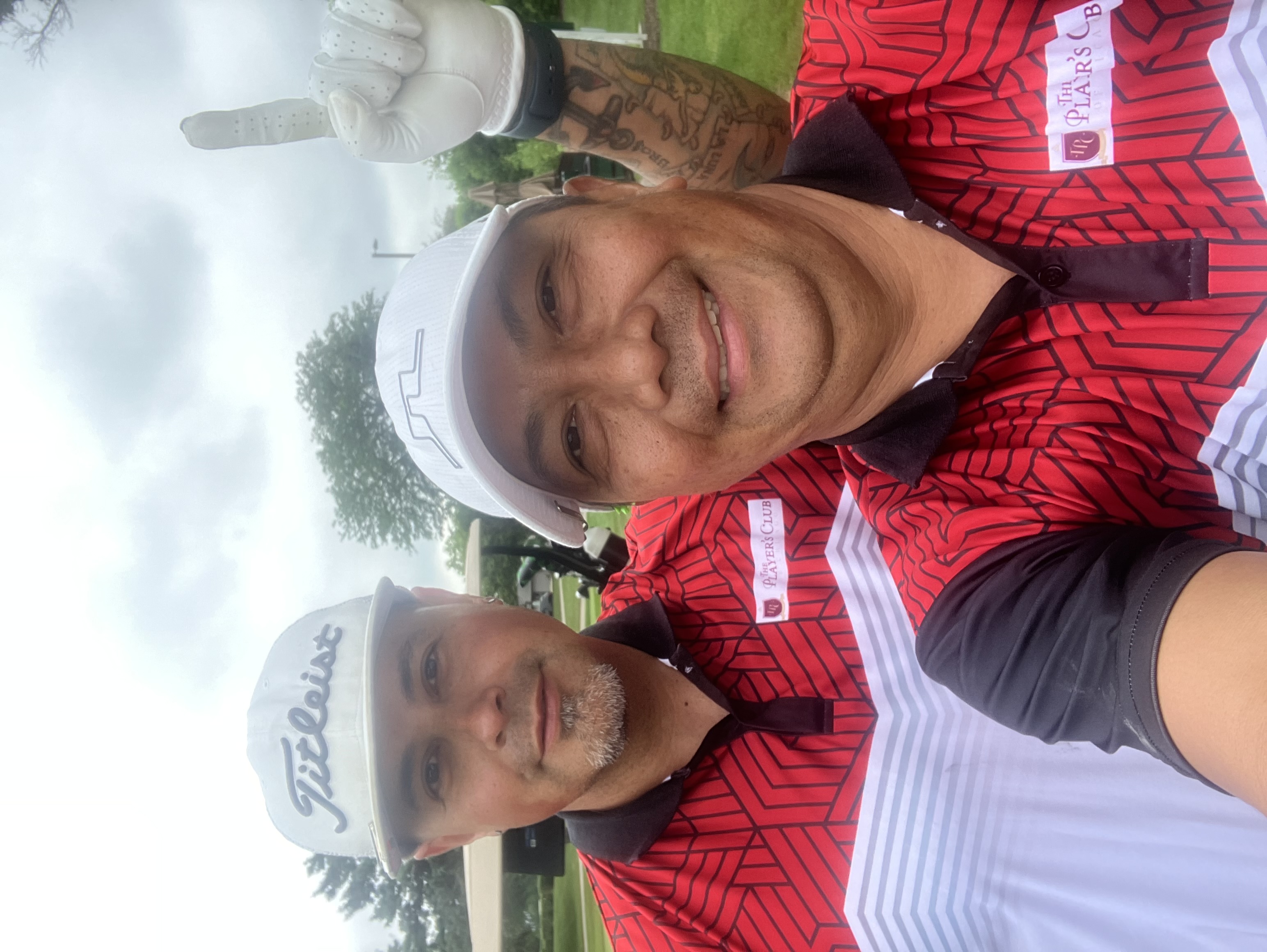 Two members in matching Players Club gear on the course