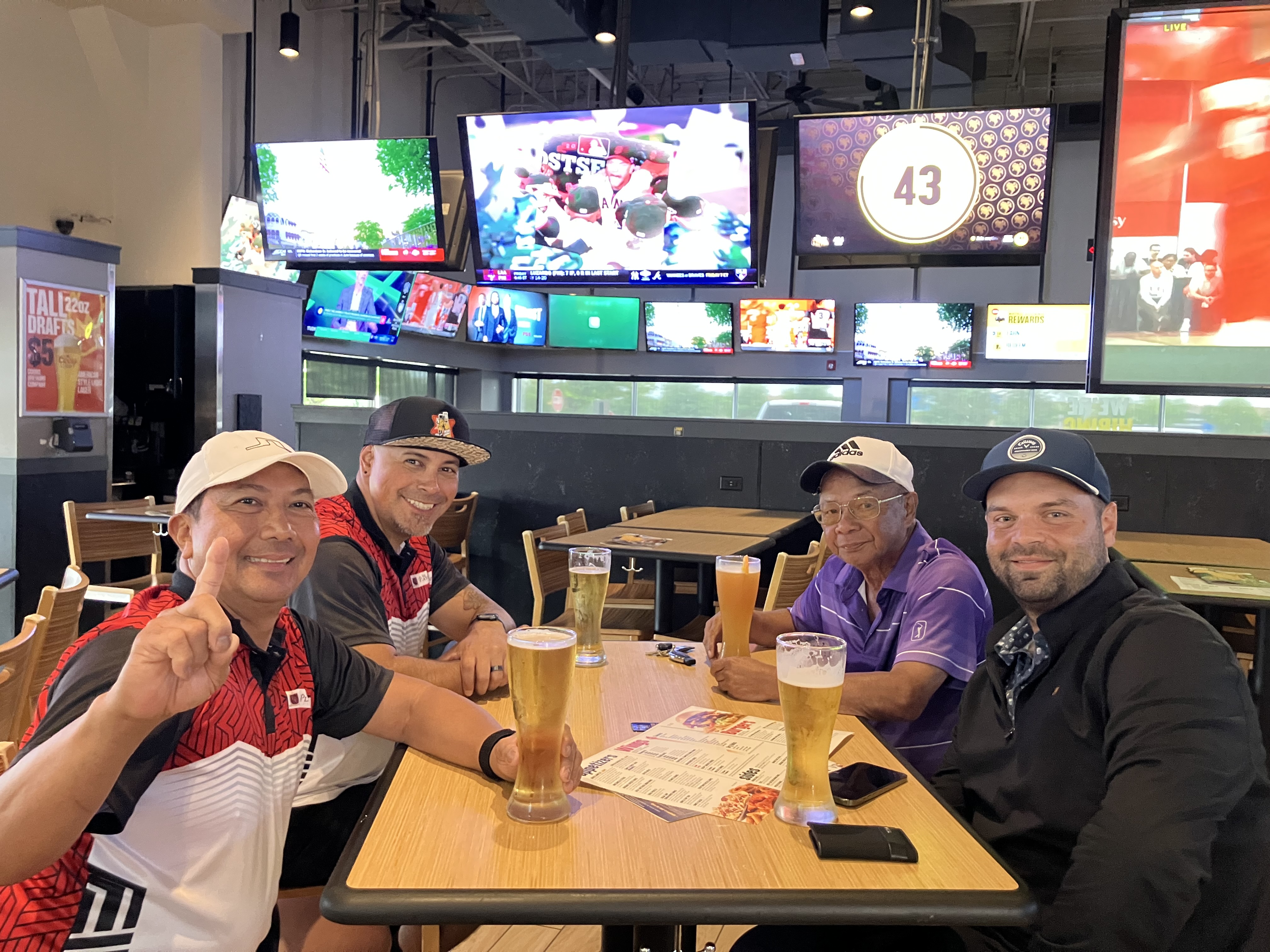 FAGA members enjoying drinks and laughs after a round